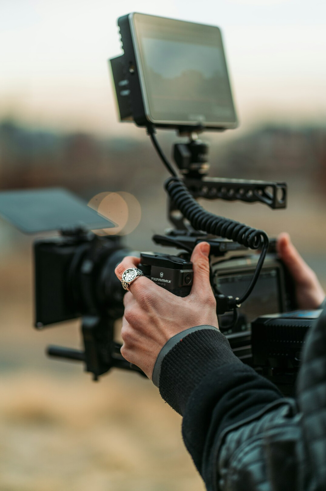 cinematographer adjusting camera