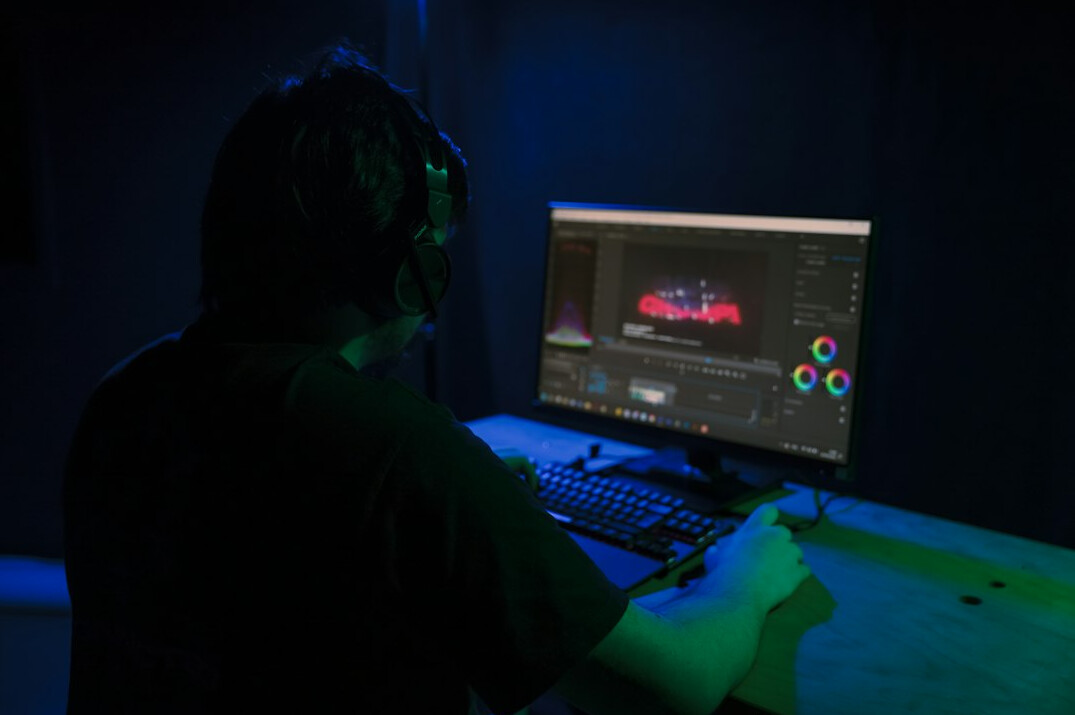 video editor working on computer